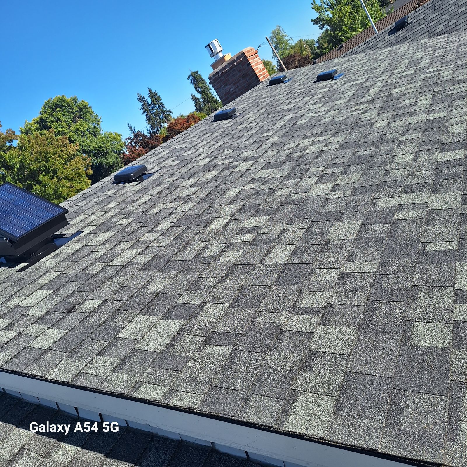 Shingle roof with chimney, vents and a solar-ready mount